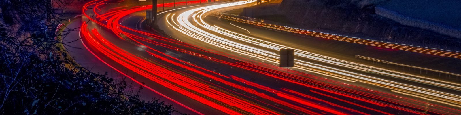 Light trails of traffic on a highway at night
